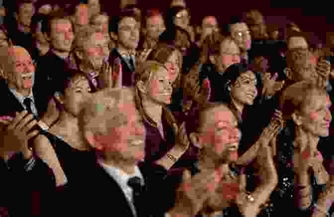 A Group Of People Watching A Play In A Theater. The Audience Is Laughing And Clapping. Underground Railway Theater Engine Of Delight Social Change